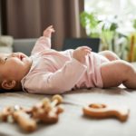 Baby girl playing on the bed