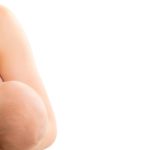 breastfeeding baby on white background