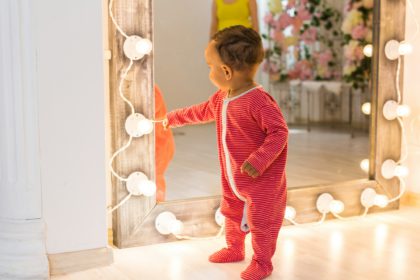 Cute curious baby study things in the room